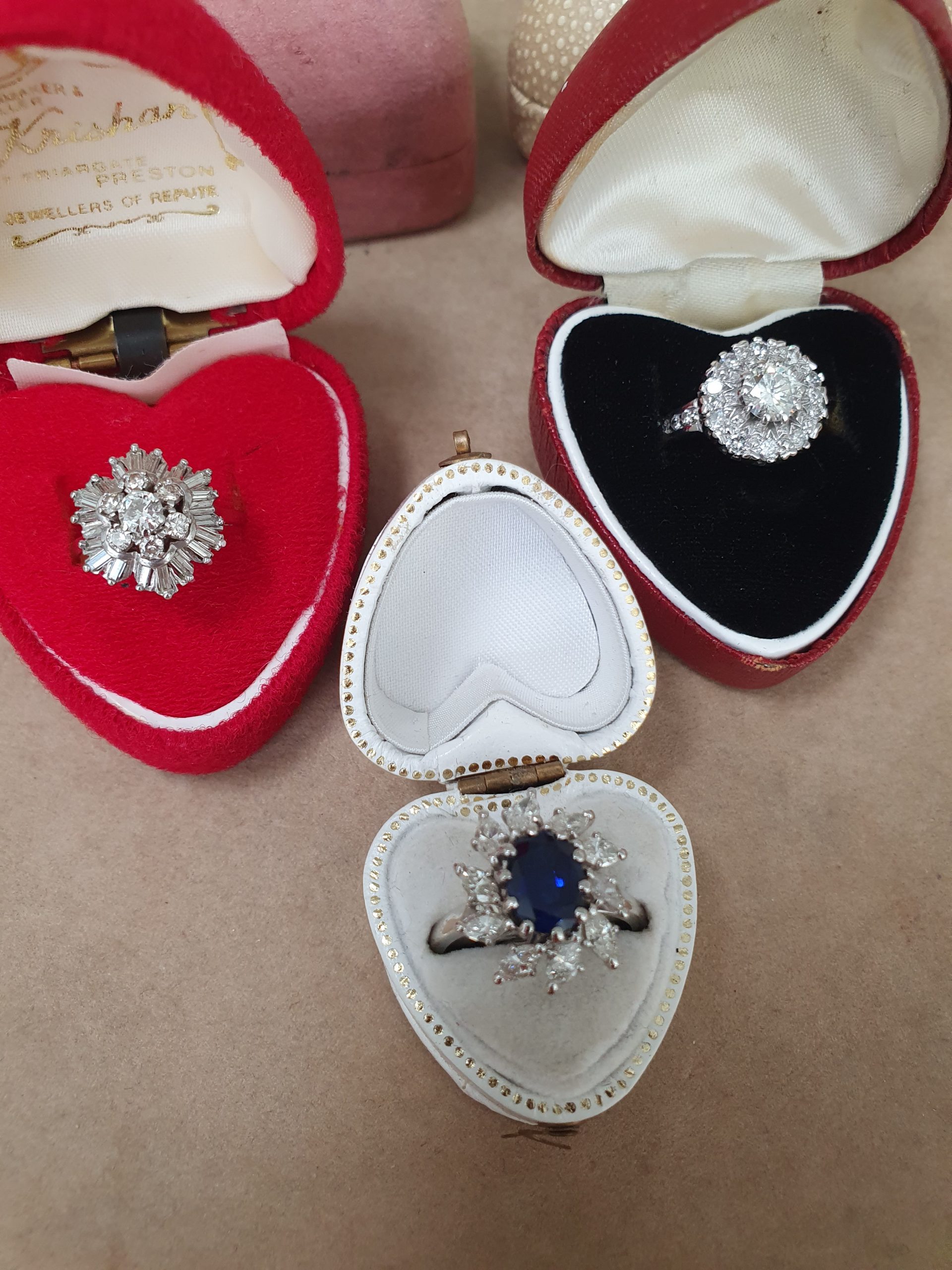 trio of vintage diamond rings in boxes